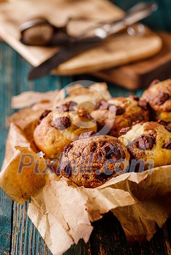Homemade Tasty Chocolate muffins on the wooden table, rustic style. Homemade Tasty Chocolate muffins on the wooden table, rustic style.
