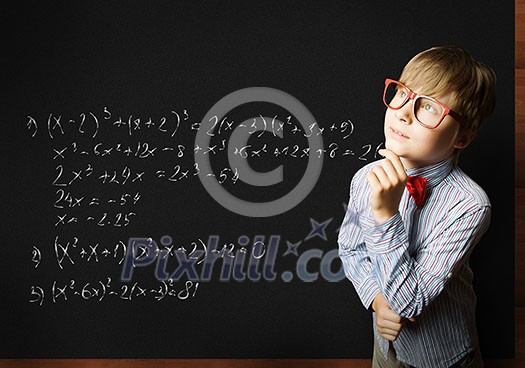 Smart boy in red glasses near blackboard with formulas Smart boy in red glasses near blackboard with formulas