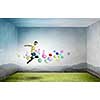 Young man jumping in sky among colorful balloons