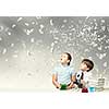 Cute girl and boy at chemistry lesson making tests