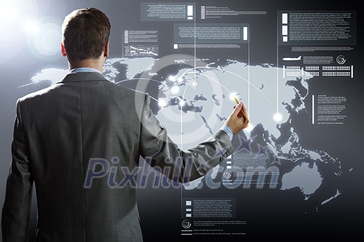 Rear view of businessman touching icon of media screen Rear view of businessman touching icon of media screen