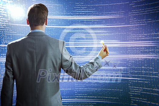 Rear view of businessman touching icon of media screen Rear view of businessman touching icon of media screen