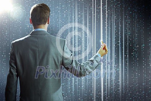 Rear view of businessman touching icon of media screen Rear view of businessman touching icon of media screen