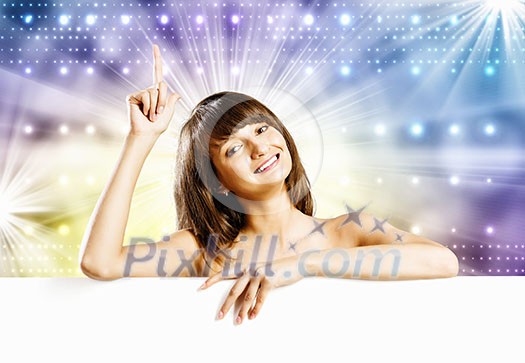 Young naked girl holding white blank banner. Place for text Young naked girl holding white blank banner. Place for text