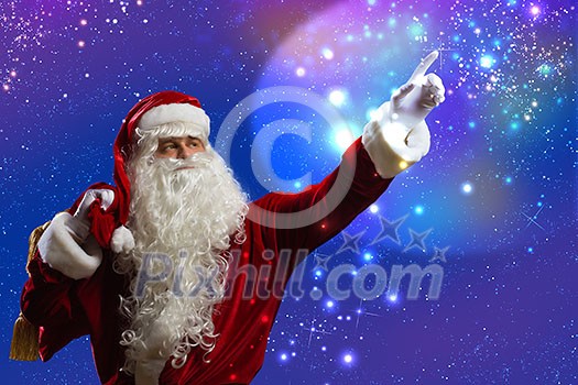 Santa Claus touching icon of media screen Santa Claus touching icon of media screen