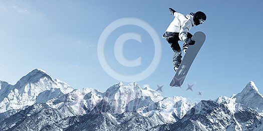 Snowboarder making high jump in clear blue sky Snowboarder making high jump in clear blue sky