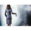 Rear view of businesswoman holding old alarm clock
