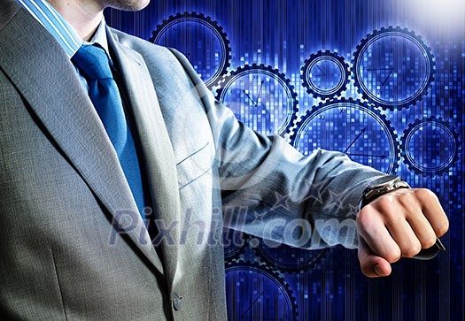 Close up of businessman looking at watch at his wrist Close up of businessman looking at watch at his wrist
