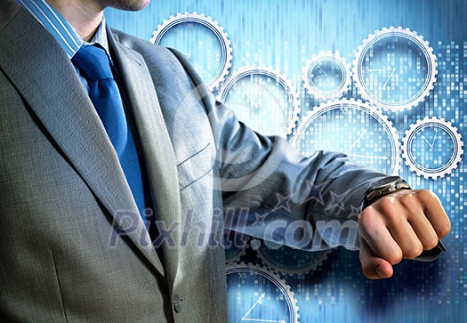 Close up of businessman looking at watch at his wrist Close up of businessman looking at watch at his wrist