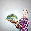 Young woman in casual hiding face behind reading. Elements of this image are furnished by NASA