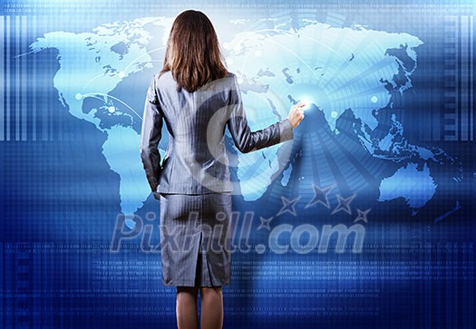 Rear view of busineswoman touching digital screen Rear view of busineswoman touching digital screen