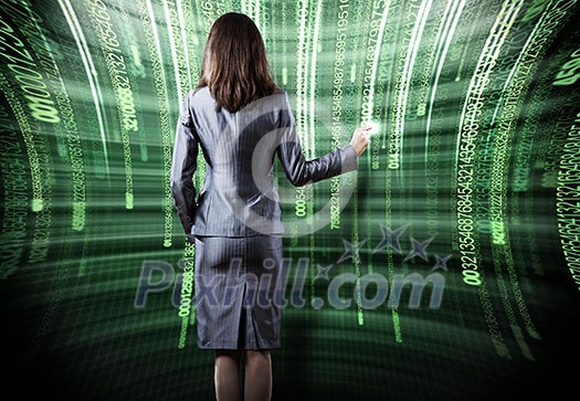Rear view of busineswoman touching digital screen Rear view of busineswoman touching digital screen