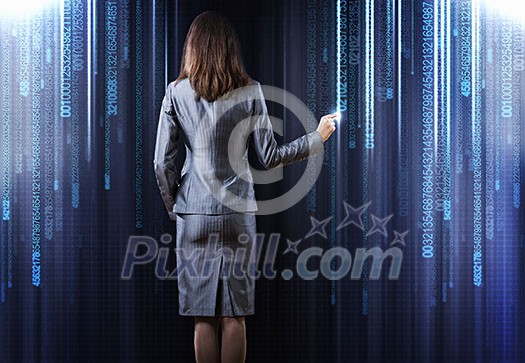 Rear view of busineswoman touching digital screen Rear view of busineswoman touching digital screen