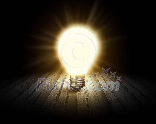Conceptual image with light bulb and wooden surface Conceptual image with light bulb and wooden surface