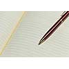Close up of blank opened notepad and pen