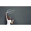 Cute little girl standing with back and drawing on blackboard