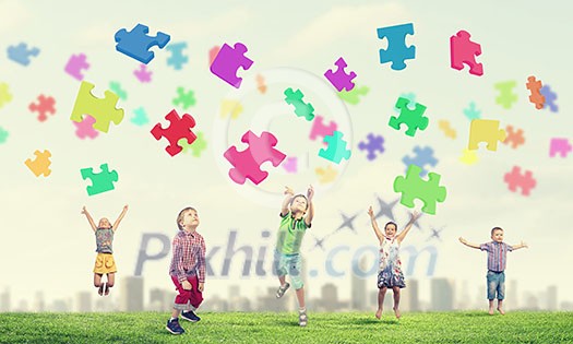 Group of children jumping high joyfully on natural background Group of children jumping high joyfully on natural background