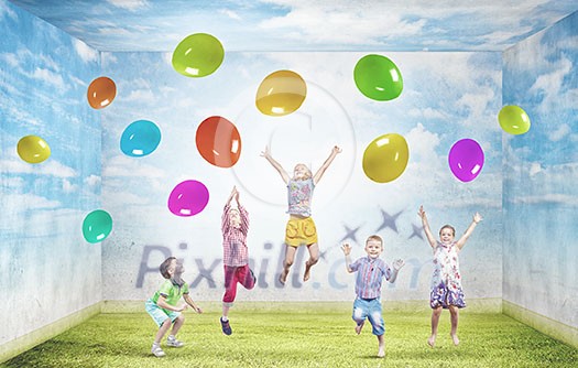 Group of happy children playing with colorful balloons Group of happy children playing with colorful balloons