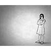 Silhouette of drawn school girl on concrete wall