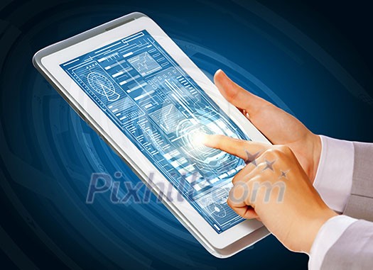 Close up of finger touching blue toned screen on tablet pc Close up of finger touching blue toned screen on tablet pc