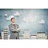 Young handsome businessman wearing white paper crown