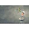 Young handsome businessman wearing white paper crown