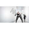 Businessman bent over and evading from flying puzzle element