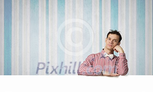 Young man in casual with white blank banner Young man in casual with white blank banner
