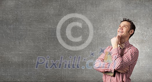 Portrait of handsome young thoughtful man with hand on chin Portrait of handsome young thoughtful man with hand on chin
