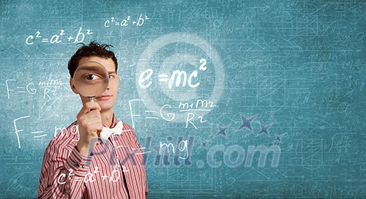 Funny image of young man looking in magnifying glass Funny image of young man looking in magnifying glass