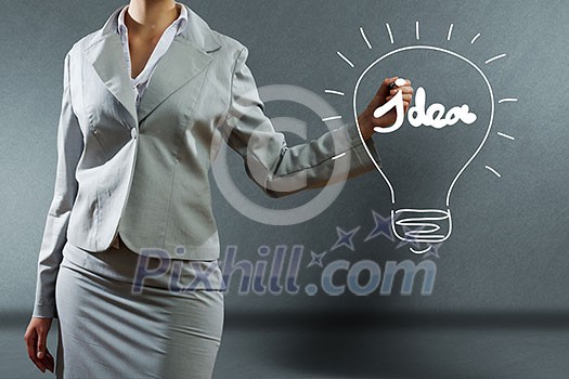 Bottom view of businesswoman drawing business sketches Bottom view of businesswoman drawing business sketches