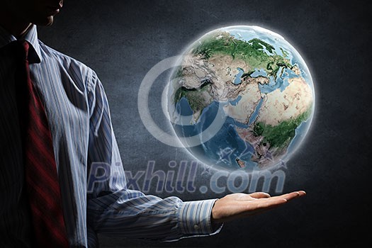 Close up of human hands holding Earth planet. Elements of this image are furnished by NASA Close up of human hands holding Earth planet. Elements of this image are furnished by NASA