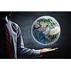 Close up of human hands holding Earth planet. Elements of this image are furnished by NASA