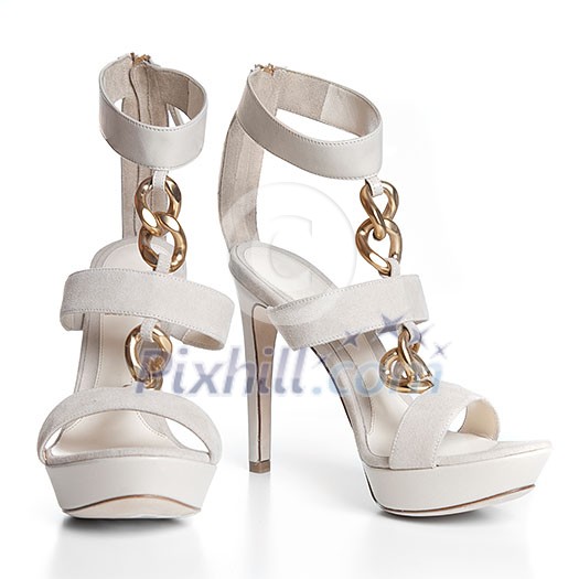 White leather female shoes on high heels isolated on white White leather female shoes on high heels isolated on white