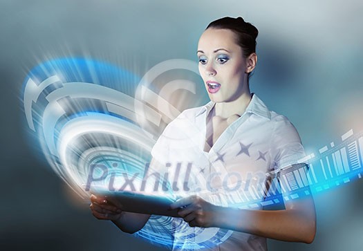 Young woman looking with surprise in tablet pc Young woman looking with surprise in tablet pc