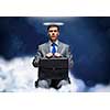 Young businessman with halo above head sitting on chair