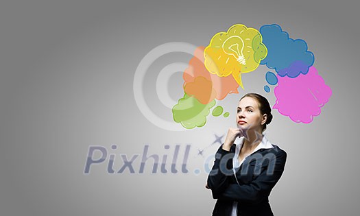 Young thoughtful businesswoman and colorful speech bubbles above Young thoughtful businesswoman and colorful speech bubbles above