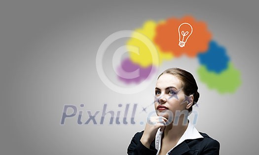 Young thoughtful businesswoman and colorful speech bubbles above
