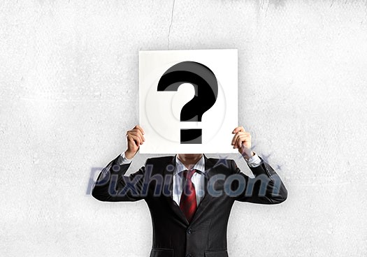 Businessman hiding his face with sheet of paper with sketches at background Businessman hiding his face with sheet of paper with sketches at background