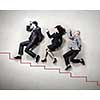 Funny businesspeople lying on floor and acting like running