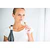 Gorgeous young woman with a glass of wine, smelling the lovely drink, savouring every sip (shallow DOF; color toned image)