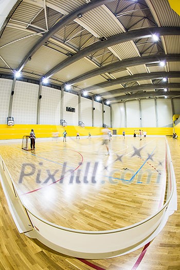 Interior of a modern multifunctional gymnasium with young people Interior of a modern multifunctional gymnasium with young people