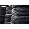 Tires for sale at a tire store - stacks of old used tires
