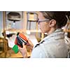 Pretty young woman  choosing the right material/color for her modern appartement interior (shallow DOF; color toned image)
