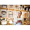Pretty young woman  choosing the right material/color for her modern appartement interior (shallow DOF; color toned image)