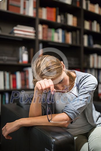 Woman suffering from depression Sitting in a chair (shallow DOF) Woman suffering from depression Sitting in a chair (shallow DOF)