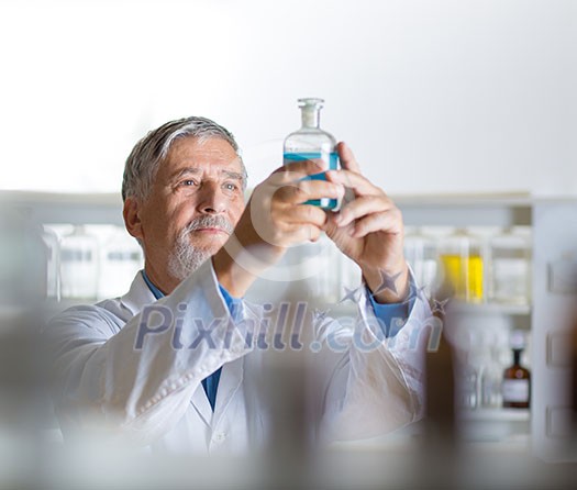 Senior male researcher carrying out scientific research in a lab (shallow DOF; color toned image) Senior male researcher carrying out scientific research in a lab (shallow DOF; color toned image)