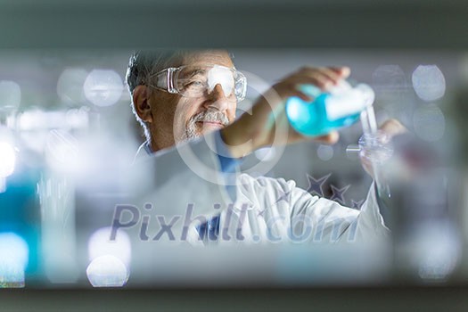 Senior male researcher carrying out scientific research in a lab (shallow DOF; color toned image) Senior male researcher carrying out scientific research in a lab (shallow DOF; color toned image)