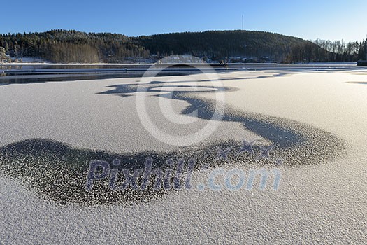 Ice and snow on the lake in november Ice and snow on the lake in november