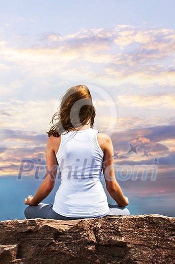 Portrait of young teenage girl practicing yoga at sunset Portrait of young teenage girl practicing yoga at sunset